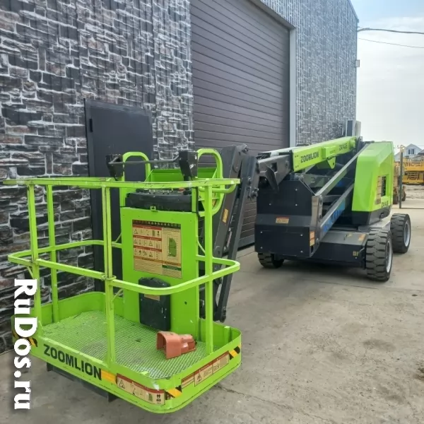 Купить строительные подъемники б/у - с НДС - Ножничный , коленчатый подъемник - Продажа фотка